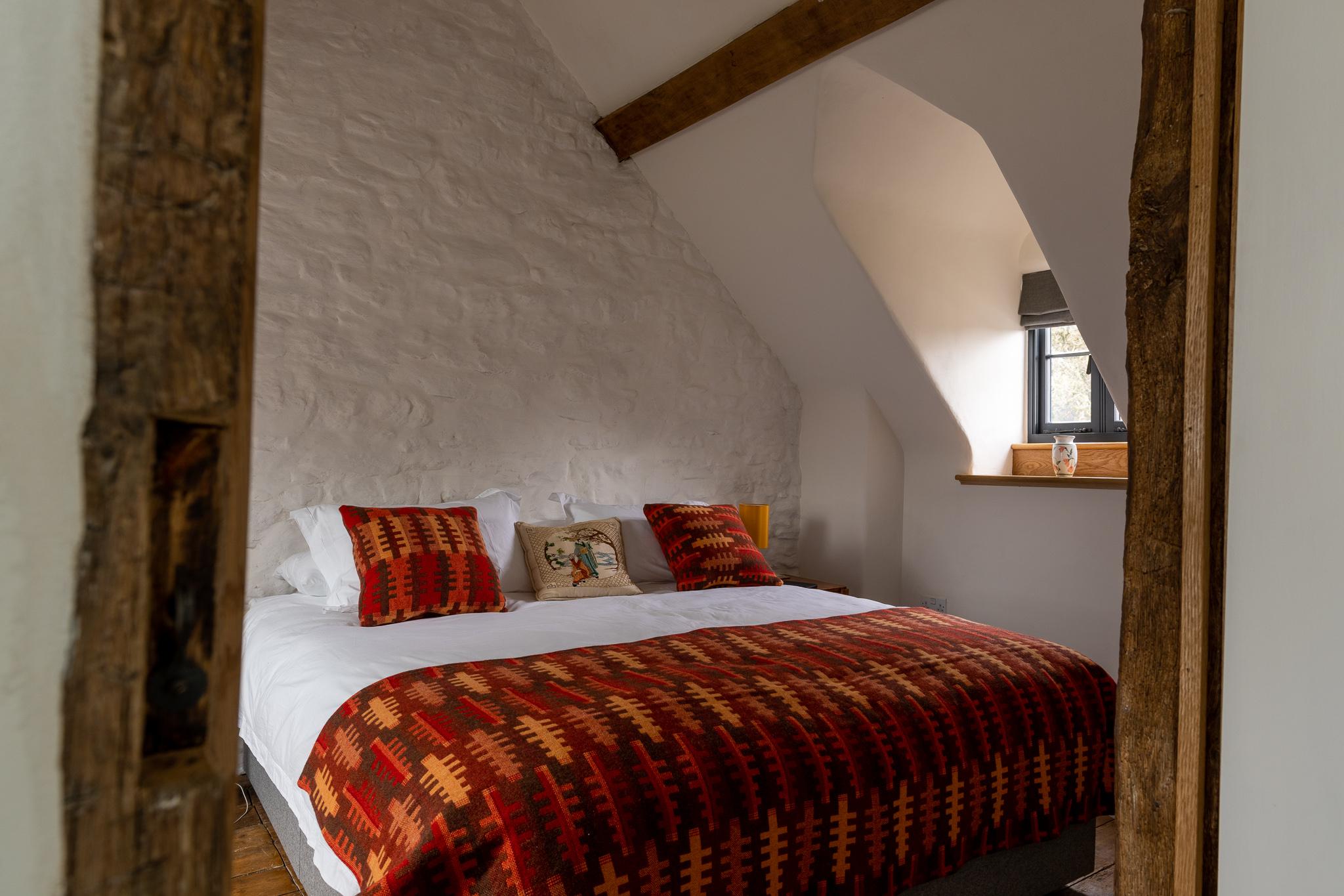 Bedroom restoration and new dormer window in historic Welsh farmhouse.