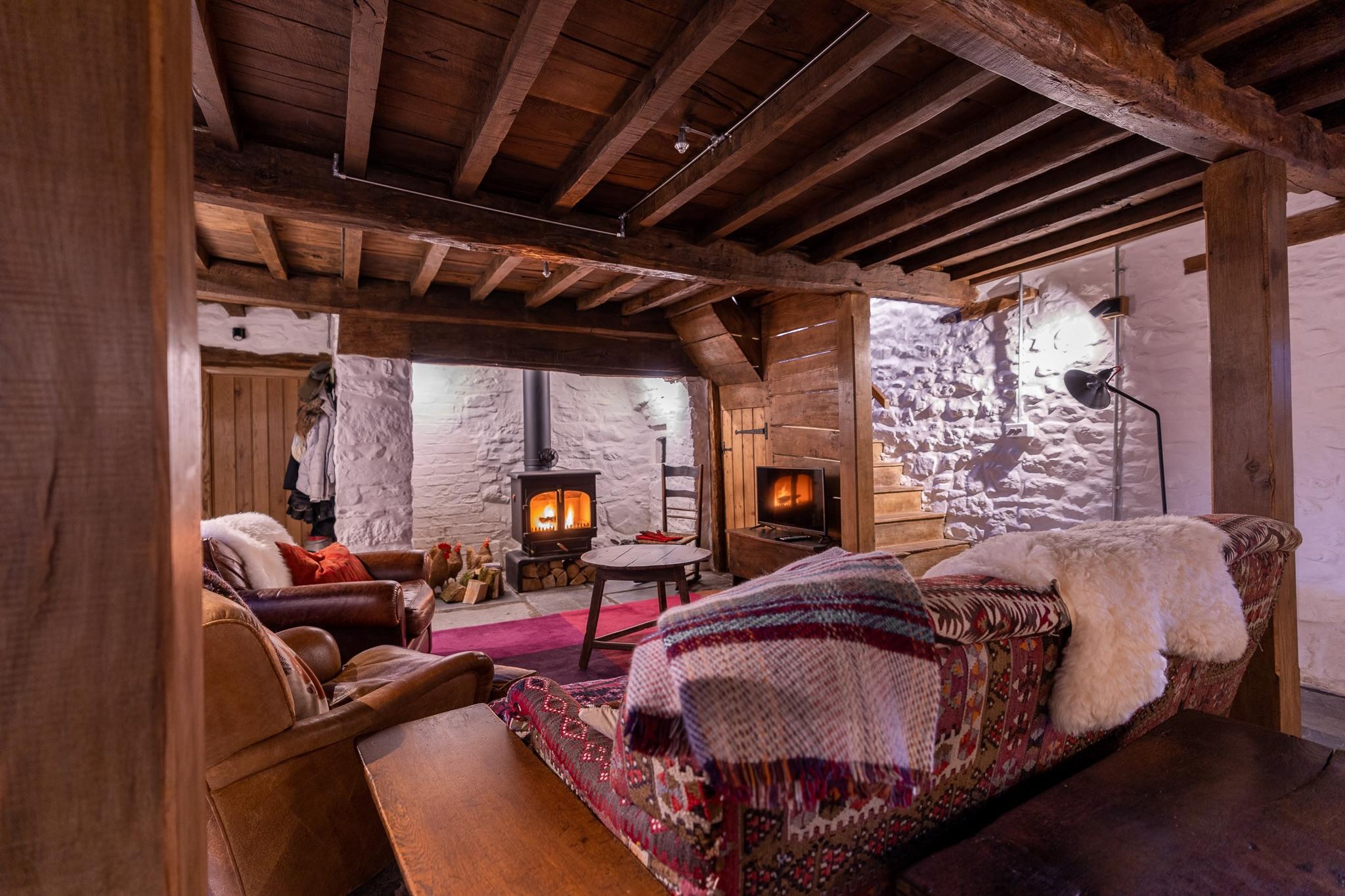 All historic features restored in the 17th century Welsh longhouse, including inglenook fireplace.