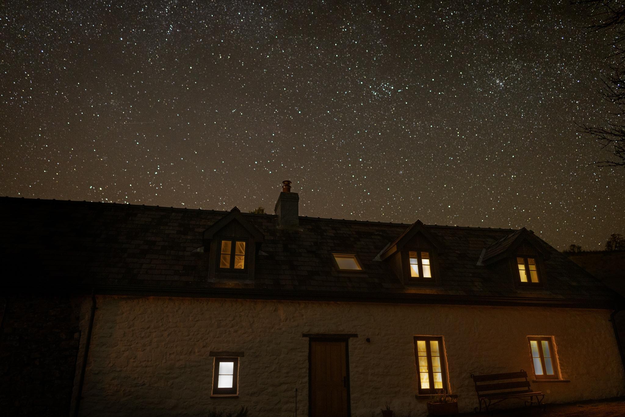 Dark sky photographed over the renovated Welsh longhouse.