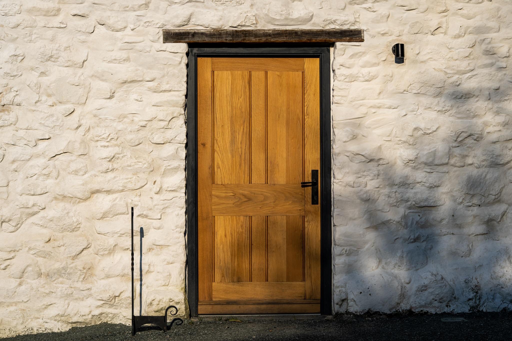 New solid Oak front door to a traditional restored Welsh longhouse.