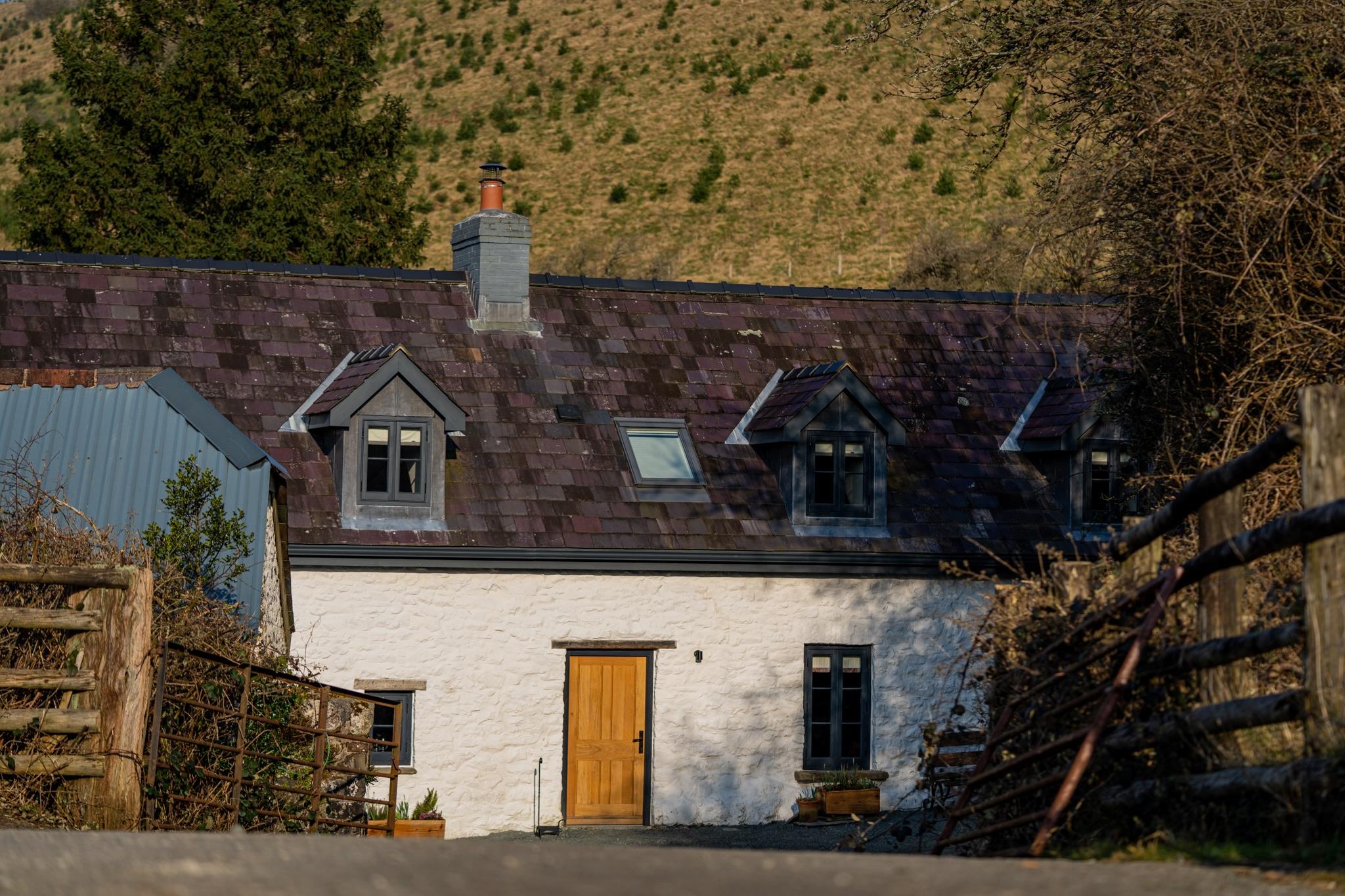 Front entrance to a newly restored Welsh longhouse and farmstead.